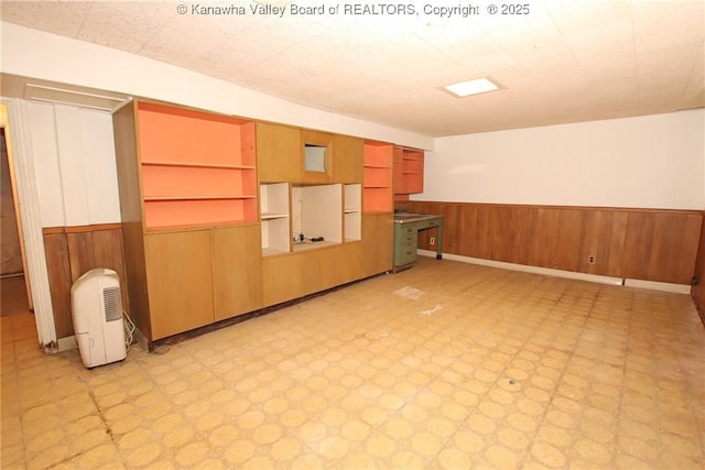 4312 Lancaster Ave, Charleston, WV 25304 - spare room featuring a wainscoted wall, wooden walls, and light floors