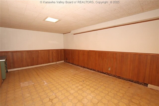 4312 Lancaster Ave, Charleston, WV 25304 - empty room with light flooring, wainscoting, and wooden walls