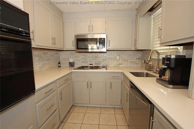 4312 Lancaster Ave, Charleston, WV 25304 - kitchen with stainless steel appliances, light tile patterned floors, light countertops, and decorative backsplash