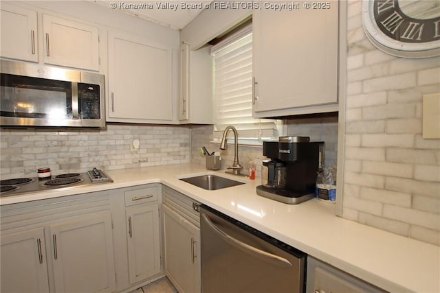 4312 Lancaster Ave, Charleston, WV 25304 - kitchen with appliances with stainless steel finishes, light countertops, and decorative backsplash
