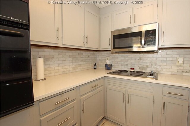 4312 Lancaster Ave, Charleston, WV 25304 - kitchen featuring stainless steel appliances, tasteful backsplash, light countertops, and a warming drawer