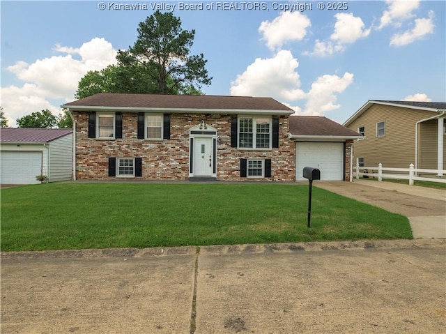 123 Dodd St, Poca, WV 25159 - split foyer home with concrete driveway, brick siding, and a garage