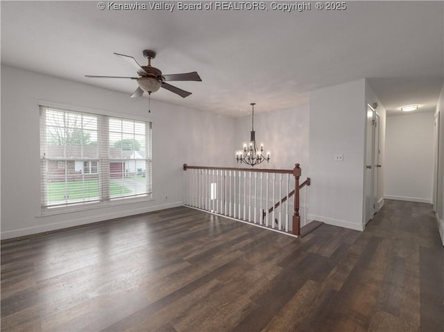 123 Dodd St, Poca, WV 25159 - unfurnished room with a chandelier, dark wood finished floors, and a ceiling fan
