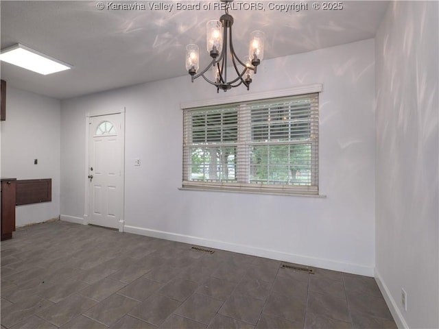 123 Dodd St, Poca, WV 25159 - unfurnished dining area with a chandelier and baseboards