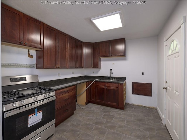 123 Dodd St, Poca, WV 25159 - kitchen with stainless steel gas range oven and dark countertops
