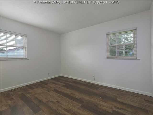 123 Dodd St, Poca, WV 25159 - empty room featuring plenty of natural light and dark wood-style flooring