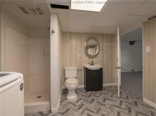 123 Dodd St, Poca, WV 25159 - bathroom featuring washer / clothes dryer, vanity, a shower stall, brick patterned flooring, and wooden walls