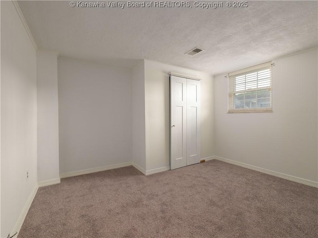 123 Dodd St, Poca, WV 25159 - unfurnished bedroom featuring carpet, a textured ceiling, and a closet