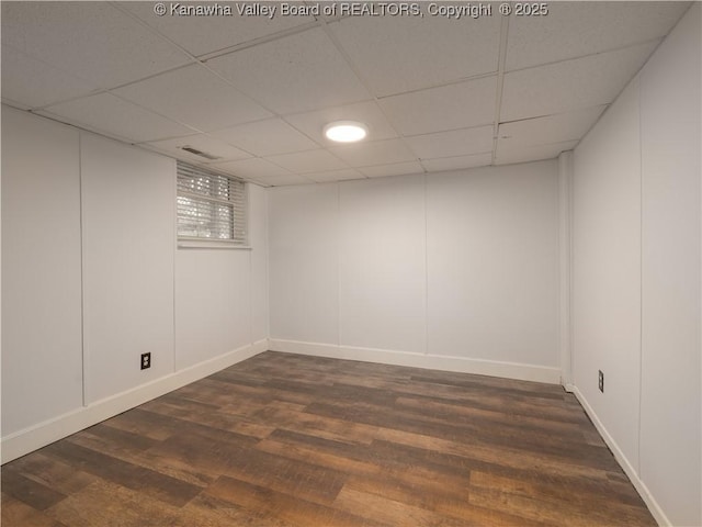 123 Dodd St, Poca, WV 25159 - finished basement with dark wood-style floors and a paneled ceiling