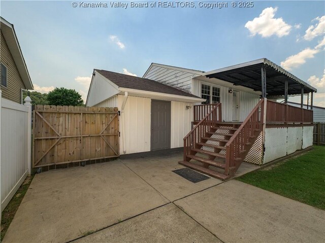 123 Dodd St, Poca, WV 25159 - view of front of house featuring a gate and board and batten siding