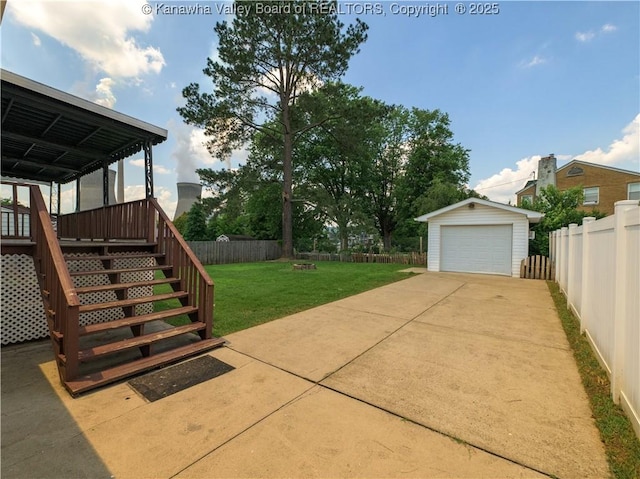 123 Dodd St, Poca, WV 25159 - fenced backyard featuring an outbuilding, a garage, driveway, and stairs