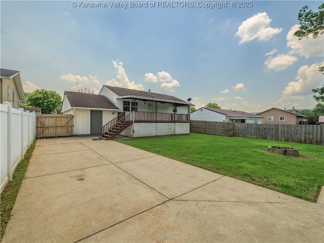 123 Dodd St, Poca, WV 25159 - fenced backyard with an outdoor fire pit, a patio area, and a wooden deck