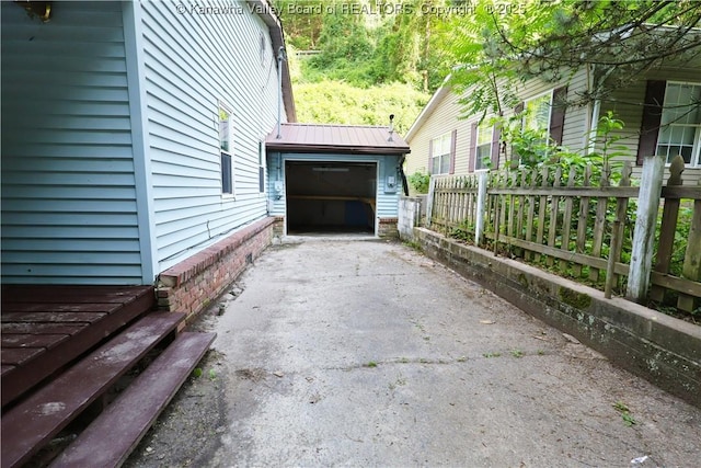 442 Porter Rd, Charleston, WV 25314 - view of home's exterior featuring asphalt driveway, a garage, and a metal roof