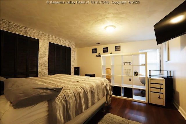 442 Porter Rd, Charleston, WV 25314 - bedroom featuring wood finished floors and brick wall