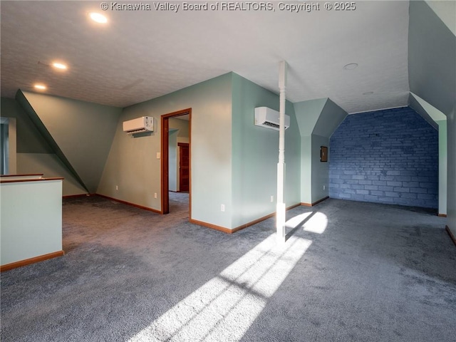 623 11th Ave, Huntington, WV 25701 - bonus room featuring a wall mounted AC, carpet flooring, recessed lighting, vaulted ceiling, and brick wall