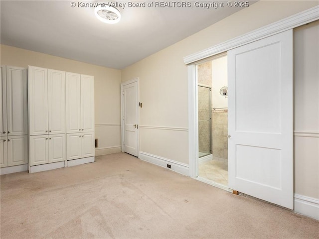 623 11th Ave, Huntington, WV 25701 - unfurnished bedroom featuring light colored carpet and ensuite bath