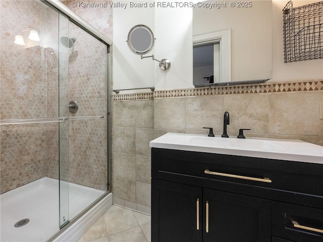 623 11th Ave, Huntington, WV 25701 - full bath with tile walls, a shower stall, and vanity