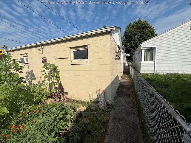 448 18th St, Dunbar, WV 25064 - view of property exterior featuring concrete block siding