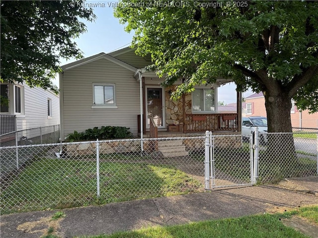448 18th St, Dunbar, WV 25064 - view of front facade with covered porch, a fenced front yard, and a gate