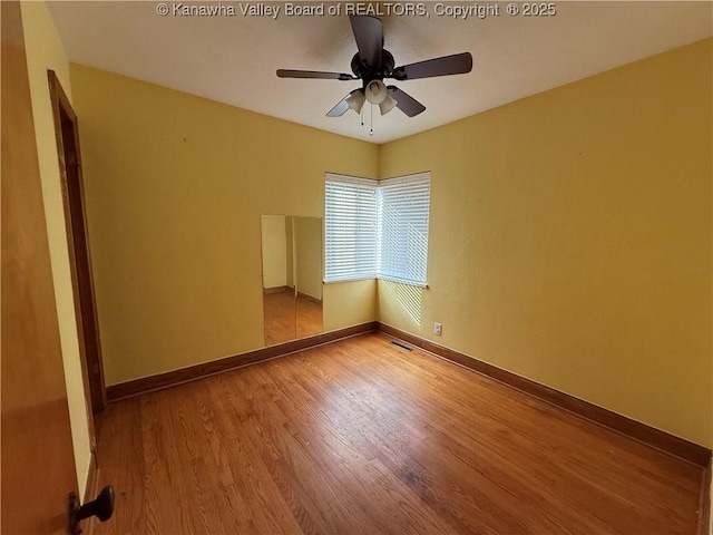 448 18th St, Dunbar, WV 25064 - spare room with wood finished floors and ceiling fan