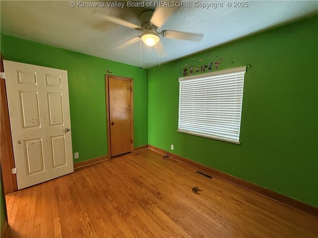 448 18th St, Dunbar, WV 25064 - unfurnished bedroom with wood finished floors and a ceiling fan