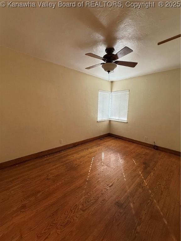 448 18th St, Dunbar, WV 25064 - spare room featuring a ceiling fan and wood finished floors