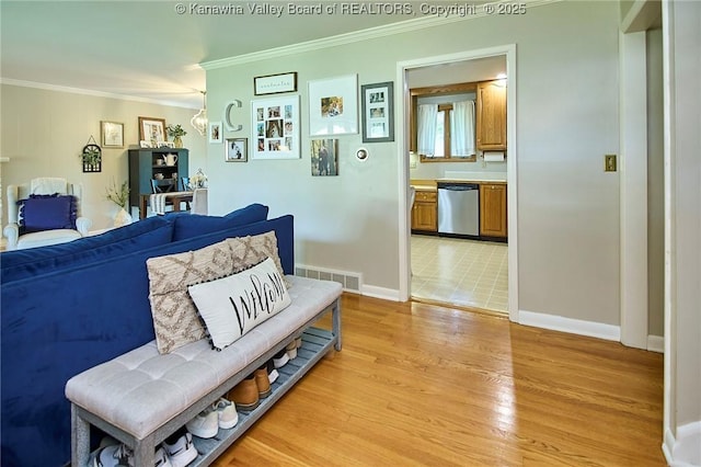 1501 Brentwood Rd, Charleston, WV 25314 - living area with crown molding, light wood-style floors, and a chandelier