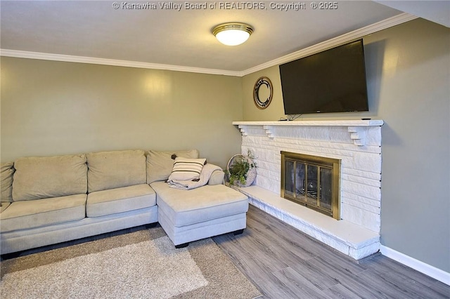 1501 Brentwood Rd, Charleston, WV 25314 - living room featuring ornamental molding, wood finished floors, and a glass covered fireplace