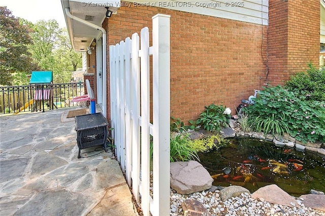 1501 Brentwood Rd, Charleston, WV 25314 - view of patio / terrace with a playground and a garden pond