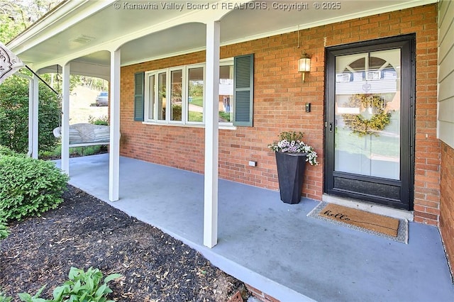 1501 Brentwood Rd, Charleston, WV 25314 - entrance to property featuring covered porch and brick siding
