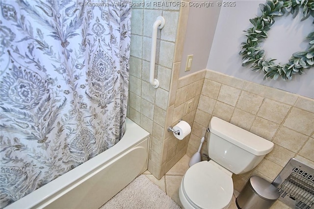 1501 Brentwood Rd, Charleston, WV 25314 - bathroom with tile walls, shower / bath combo, and a wainscoted wall