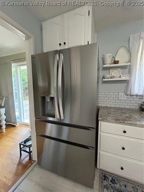 1501 Brentwood Rd, Charleston, WV 25314 - kitchen featuring stainless steel fridge, open shelves, white cabinets, backsplash, and light stone countertops