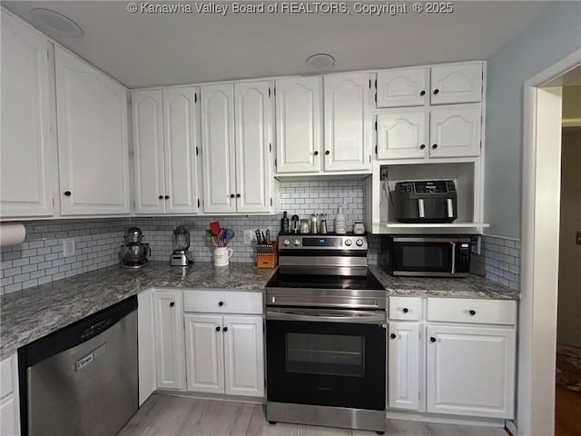 1501 Brentwood Rd, Charleston, WV 25314 - kitchen featuring stainless steel appliances and white cabinetry