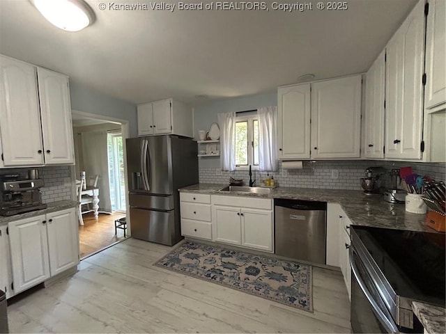 1501 Brentwood Rd, Charleston, WV 25314 - kitchen with appliances with stainless steel finishes, backsplash, white cabinetry, and open shelves