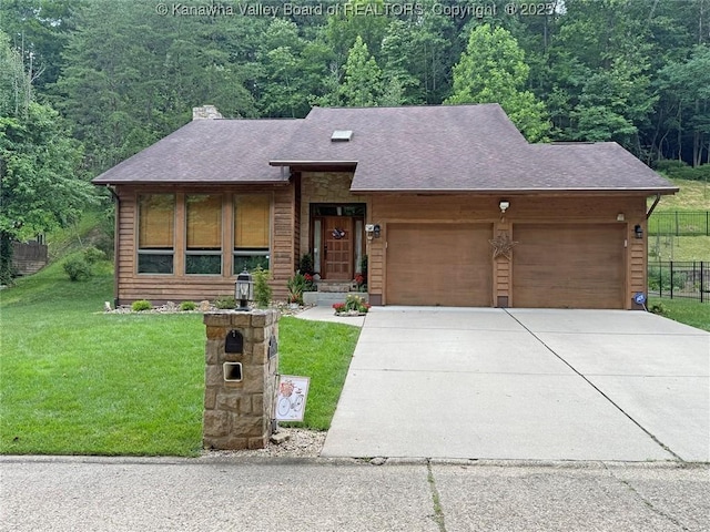 119 Falls Run Rd, Charleston, WV 25311 - view of front of house with a garage, concrete driveway, a chimney, a wooded view, and a shingled roof
