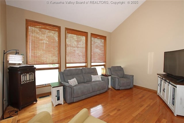 119 Falls Run Rd, Charleston, WV 25311 - living area with light wood finished floors and vaulted ceiling