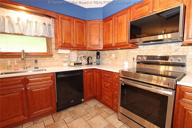 119 Falls Run Rd, Charleston, WV 25311 - kitchen featuring stainless steel appliances, light countertops, backsplash, and stone finish floors