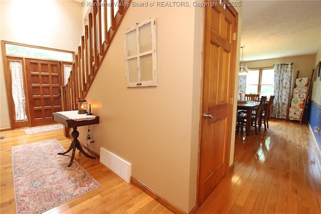 119 Falls Run Rd, Charleston, WV 25311 - hallway with light wood finished floors and stairs