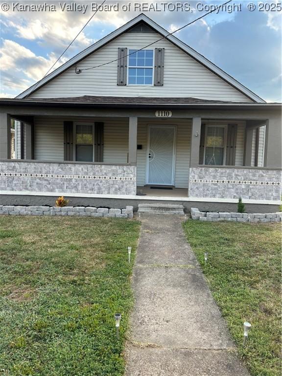 1110 Benamati Ave, Nitro, WV 25143 - view of front of house with a porch and a front lawn