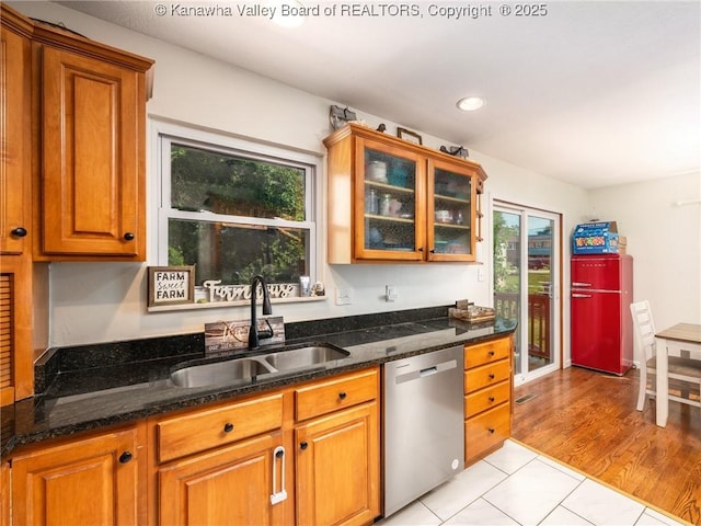 1105 Hollyberry Ln, South Charleston, WV 25309 - kitchen featuring stainless steel dishwasher, healthy amount of natural light, brown cabinetry, dark stone countertops, and recessed lighting