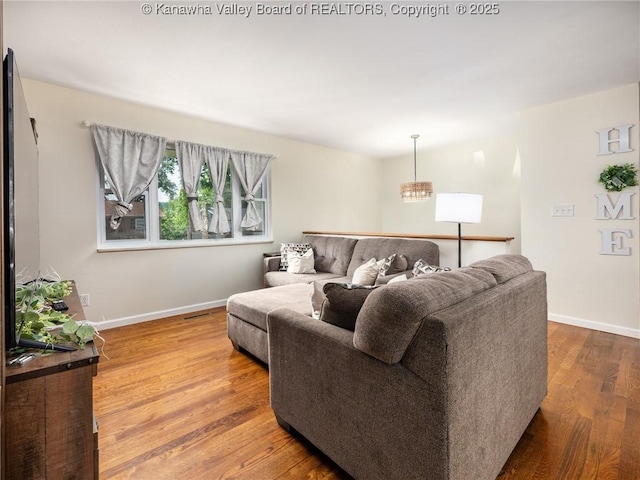 1105 Hollyberry Ln, South Charleston, WV 25309 - living area featuring wood finished floors and baseboards