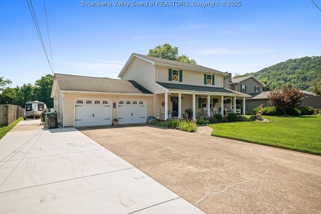 128 Westland Ests, Winfield, WV 25213 - view of front of property featuring a garage, covered porch, and driveway