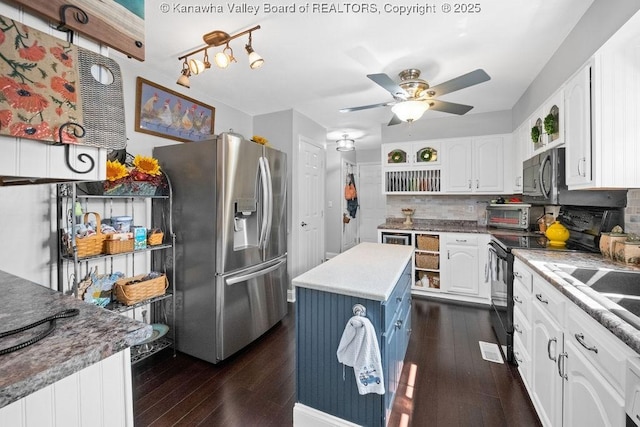 128 Westland Ests, Winfield, WV 25213 - kitchen featuring stainless steel fridge, black electric range, backsplash, white cabinetry, and dark wood-style floors