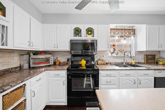 128 Westland Ests, Winfield, WV 25213 - kitchen with stainless steel microwave, black / electric stove, dishwasher, and white cabinetry