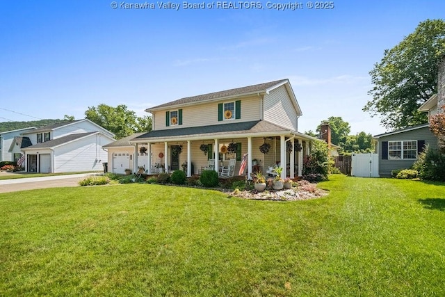 128 Westland Ests, Winfield, WV 25213 - farmhouse with covered porch, concrete driveway, and a garage