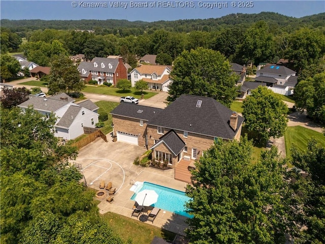 52 Cedar Dr, Hurricane, WV 25526 - aerial perspective of suburban area featuring a forest and a pool area