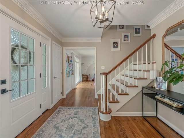 52 Cedar Dr, Hurricane, WV 25526 - entryway featuring stairway, a chandelier, wood finished floors, and crown molding