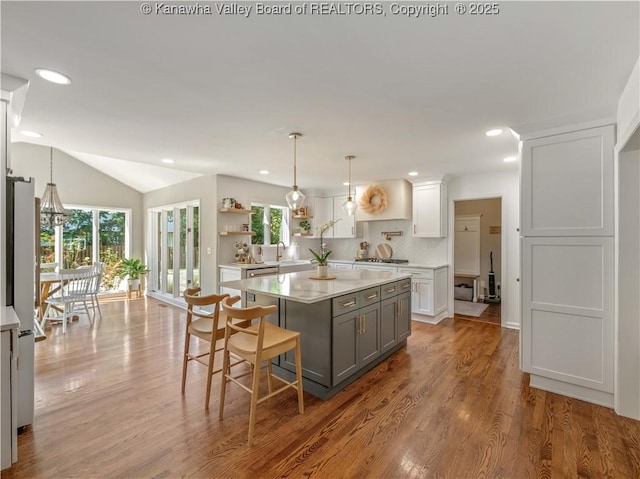 52 Cedar Dr, Hurricane, WV 25526 - kitchen with gray cabinets, stainless steel appliances, open shelves, a kitchen island, and decorative backsplash
