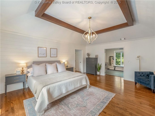 52 Cedar Dr, Hurricane, WV 25526 - bedroom featuring a raised ceiling, a chandelier, and wood finished floors