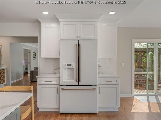 52 Cedar Dr, Hurricane, WV 25526 - kitchen with high end fridge, white cabinets, light countertops, and recessed lighting